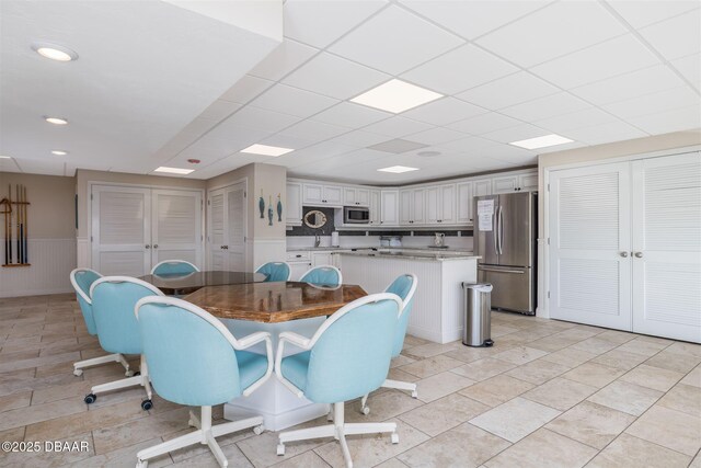 3606 S Peninsula Dr Unit 406, Port Orange, FL 32127 - dining room with wainscoting