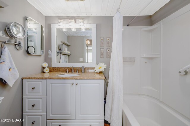 3606 S Peninsula Dr Unit 406, Port Orange, FL 32127 - bathroom featuring shower / tub combo and vanity