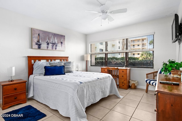 bedroom featuring light tile patterned flooring and ceiling fan