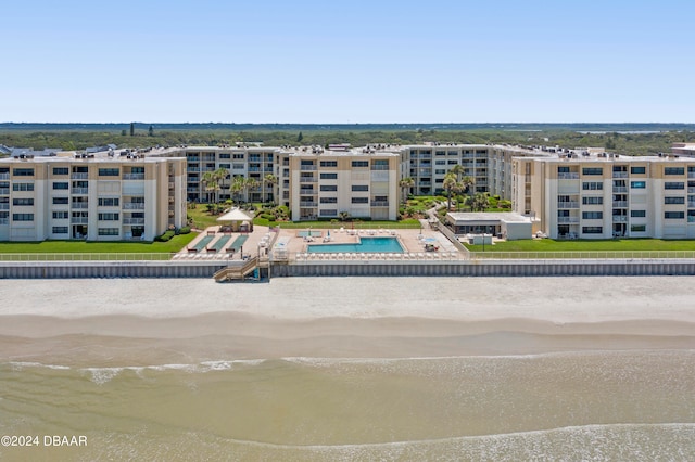 aerial view with a water view and a view of the beach