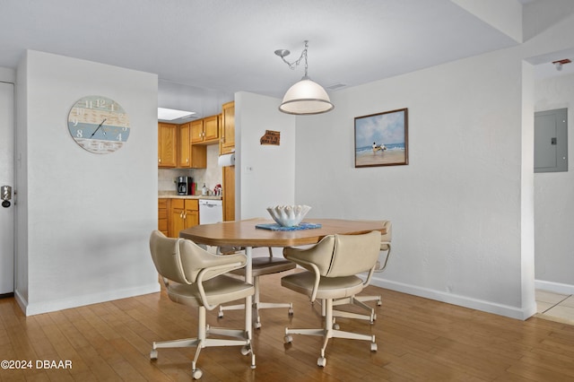 4175 S Atlantic Ave Unit 1130, New Smyrna Beach, FL 32169 - dining room featuring light wood finished floors, baseboards, and electric panel
