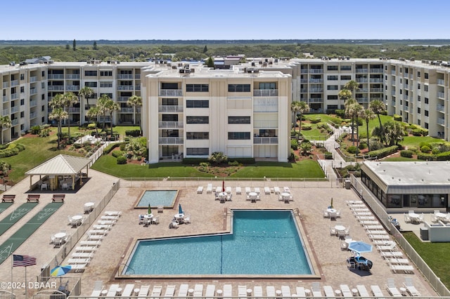 4175 S Atlantic Ave Unit 1130, New Smyrna Beach, FL 32169 - aerial view of a pool area and apartment complex
