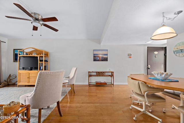 dining space featuring ceiling fan and wood-type flooring