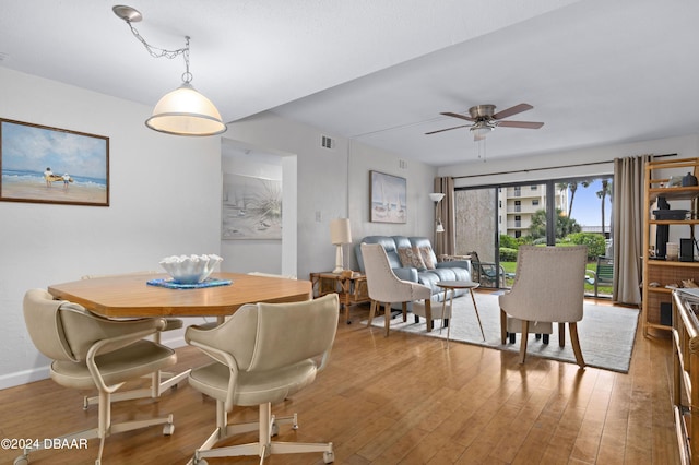 4175 S Atlantic Ave Unit 1130, New Smyrna Beach, FL 32169 - dining space with wood finished floors and ceiling fan