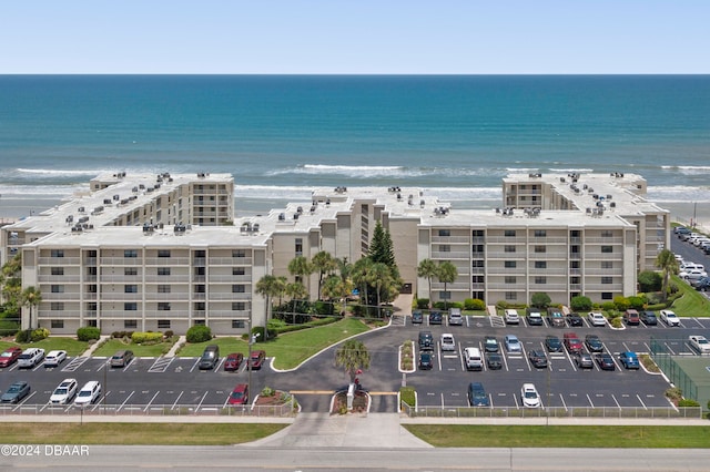 bird's eye view featuring a beach view and a water view