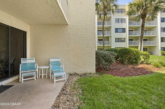 4175 S Atlantic Ave Unit 1130, New Smyrna Beach, FL 32169 - view of exterior entry featuring stucco siding