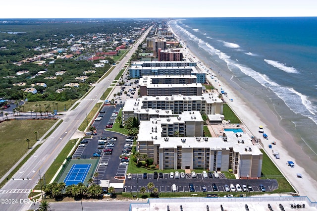 bird's eye view featuring a water view and a view of the beach