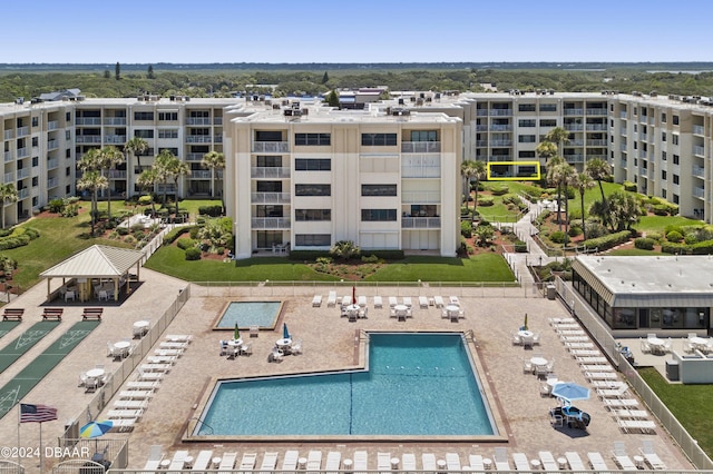 4175 S Atlantic Ave Unit 1130, New Smyrna Beach, FL 32169 - drone / aerial view of a pool and apartment complex