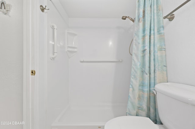4175 S Atlantic Ave Unit 1130, New Smyrna Beach, FL 32169 - bathroom featuring toilet and curtained shower
