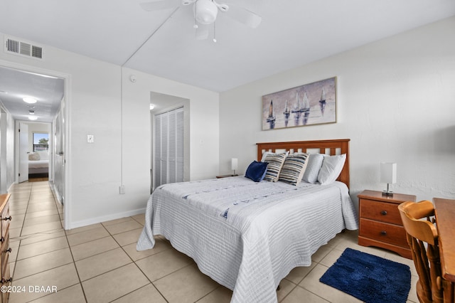 4175 S Atlantic Ave Unit 1130, New Smyrna Beach, FL 32169 - bedroom with light tile patterned floors, a closet, ceiling fan, and baseboards