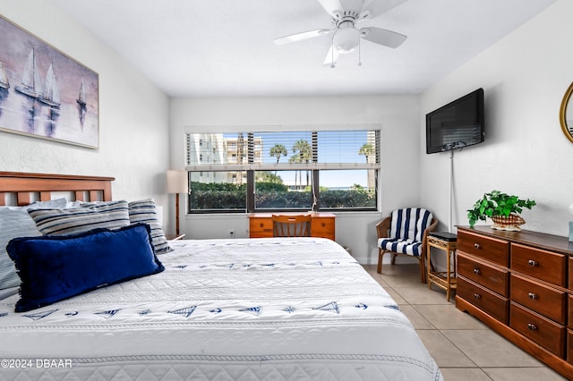 tiled bedroom with ceiling fan