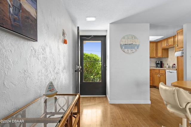 4175 S Atlantic Ave Unit 1130, New Smyrna Beach, FL 32169 - foyer featuring light wood-style flooring and baseboards