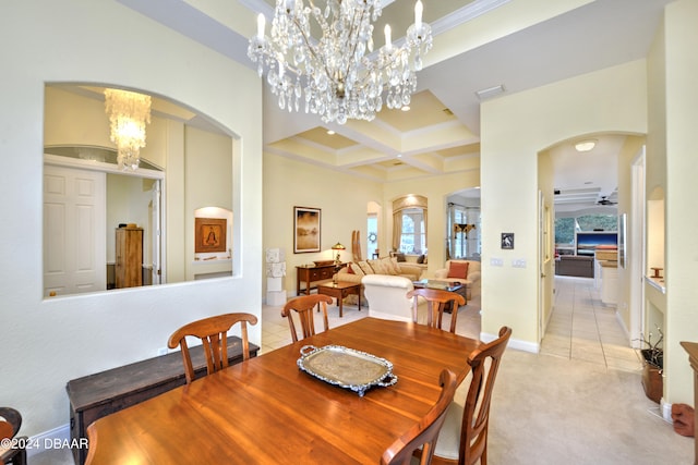 carpeted dining area featuring ornamental molding, ceiling fan with notable chandelier, beam ceiling, and coffered ceiling