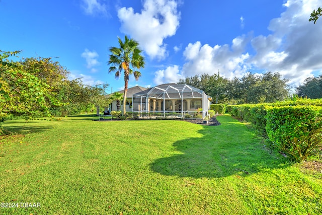 view of yard featuring glass enclosure