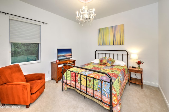 carpeted bedroom featuring a chandelier