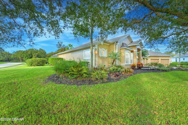 view of home's exterior featuring a garage and a yard