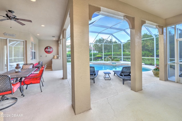 view of patio / terrace with glass enclosure and ceiling fan