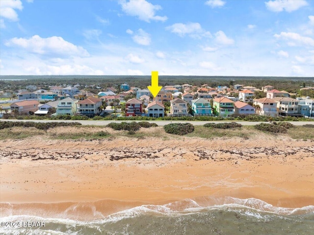 aerial view featuring a view of the beach and a water view