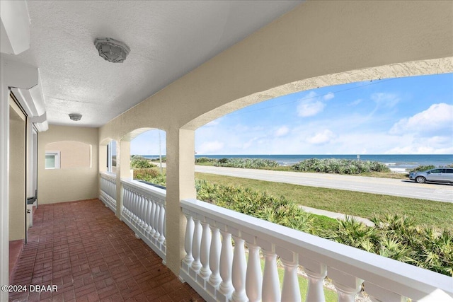 balcony featuring a water view