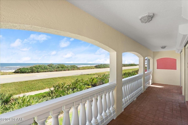 balcony featuring a water view