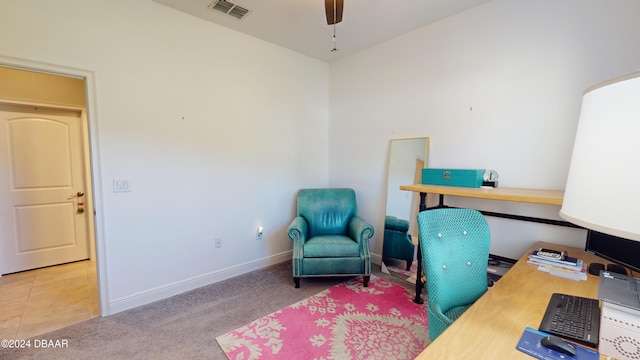 carpeted home office with ceiling fan