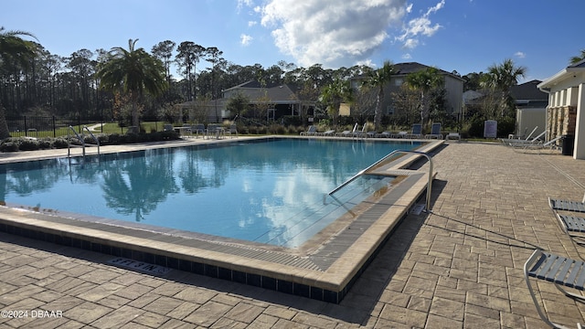 view of swimming pool featuring a patio area