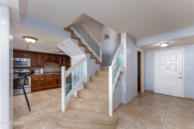 staircase with tile patterned floors