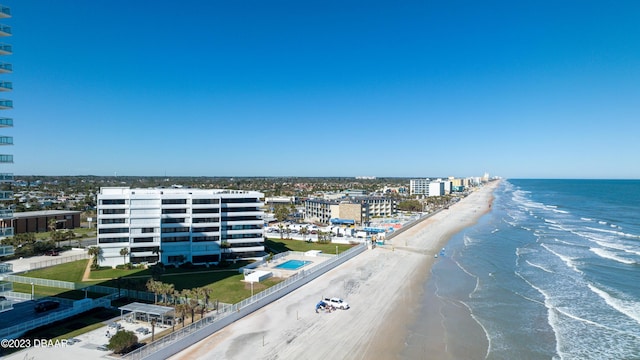 aerial view featuring a view of the beach and a water view