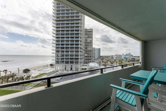 balcony featuring a water view