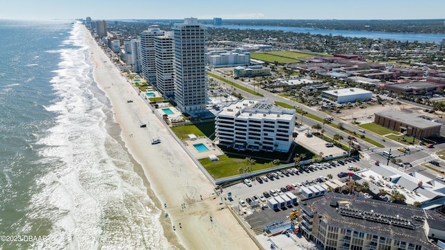 drone / aerial view with a water view and a view of the beach