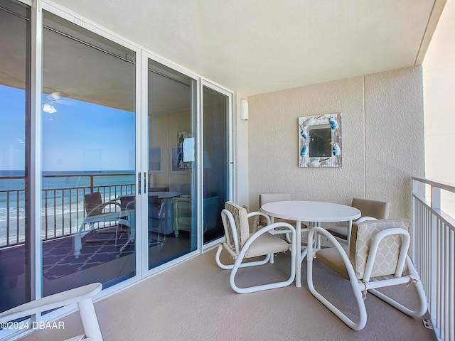 balcony featuring a water view