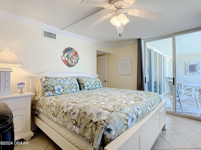 tiled bedroom featuring ceiling fan, crown molding, access to outside, and a textured ceiling