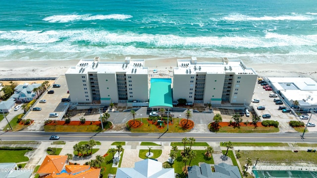 aerial view with a view of the beach and a water view