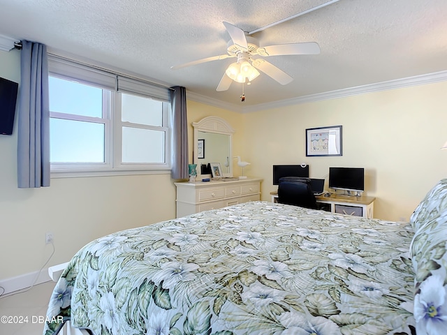 bedroom with ceiling fan, crown molding, and a textured ceiling