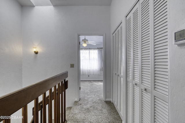 hall featuring carpet