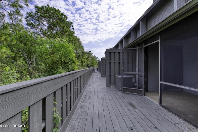 wooden terrace featuring cooling unit