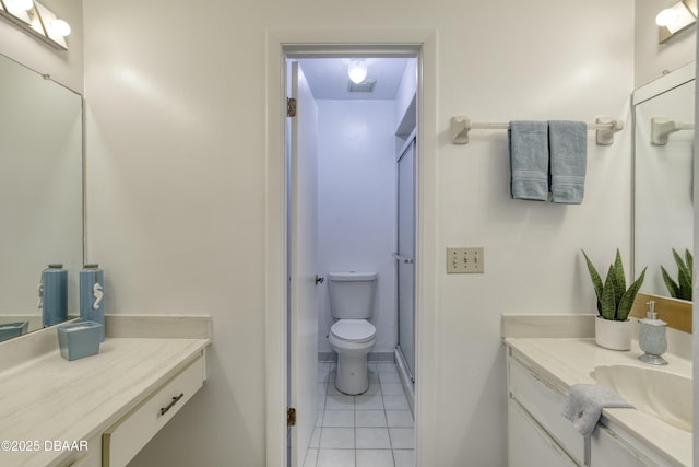 full bathroom with tile patterned floors, toilet, vanity, a shower stall, and baseboards