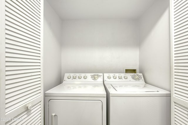 washroom with separate washer and dryer