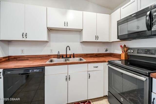16 Powder Hill Ln, Palm Coast, FL 32164 - kitchen featuring butcher block countertops, white cabinetry, a sink, and black appliances