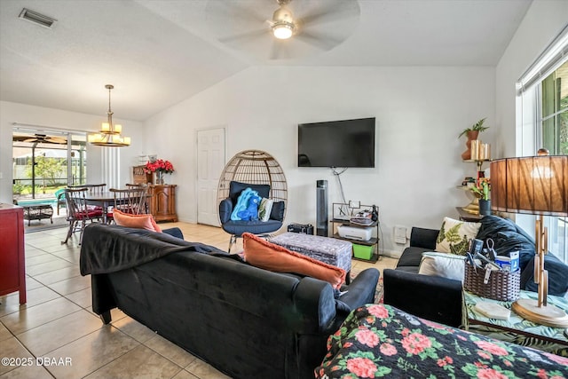 16 Powder Hill Ln, Palm Coast, FL 32164 - living room with light tile patterned floors, vaulted ceiling, visible vents, and ceiling fan with notable chandelier