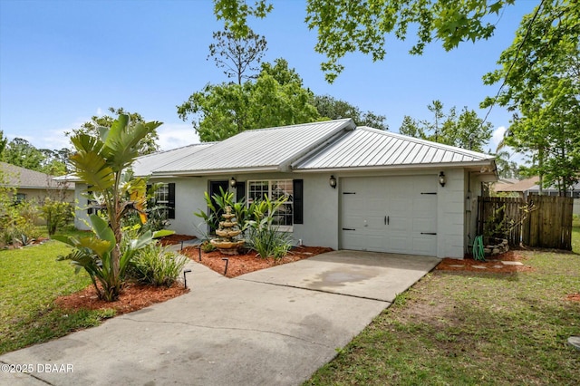 16 Powder Hill Ln, Palm Coast, FL 32164 - ranch-style home with fence, stucco siding, an attached garage, driveway, and metal roof