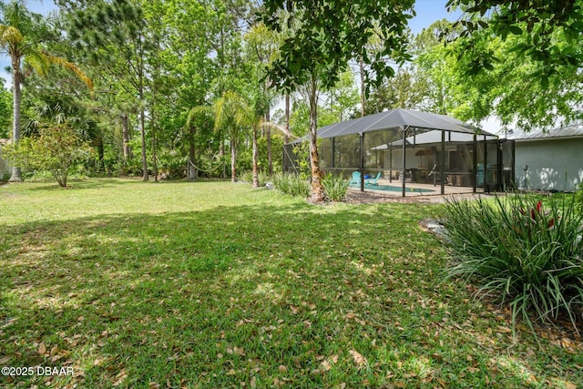 16 Powder Hill Ln, Palm Coast, FL 32164 - view of yard with a lanai and an outdoor pool