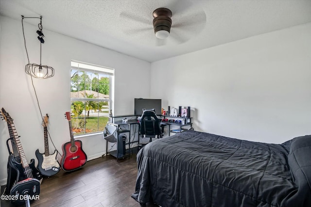 16 Powder Hill Ln, Palm Coast, FL 32164 - bedroom featuring ceiling fan, baseboards, dark wood-style flooring, and a textured ceiling