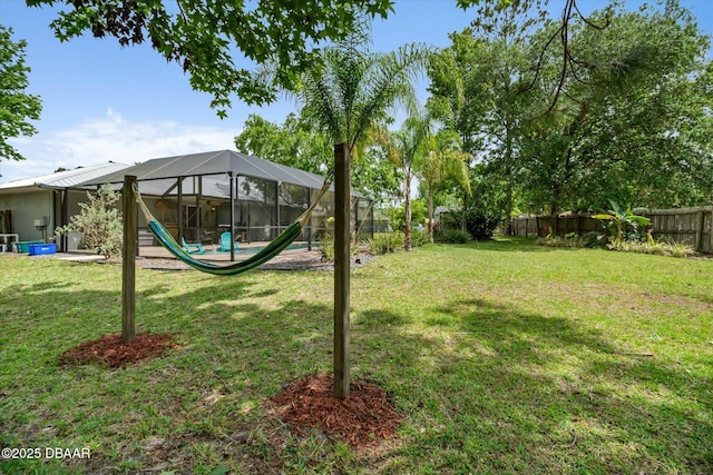 16 Powder Hill Ln, Palm Coast, FL 32164 - view of yard featuring a fenced backyard and glass enclosure