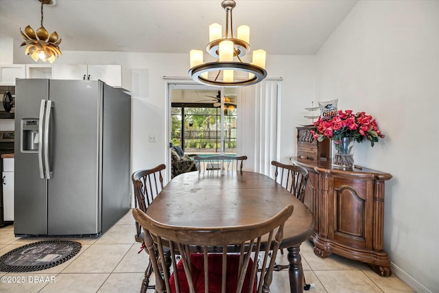 16 Powder Hill Ln, Palm Coast, FL 32164 - dining area featuring baseboards, an inviting chandelier, and light tile patterned floors