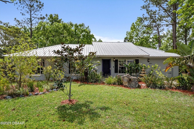 16 Powder Hill Ln, Palm Coast, FL 32164 - ranch-style home with stucco siding, a front yard, and metal roof