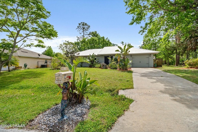 16 Powder Hill Ln, Palm Coast, FL 32164 - ranch-style house featuring concrete driveway, an attached garage, a front yard, and metal roof