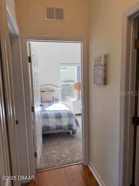 bedroom with wood-type flooring