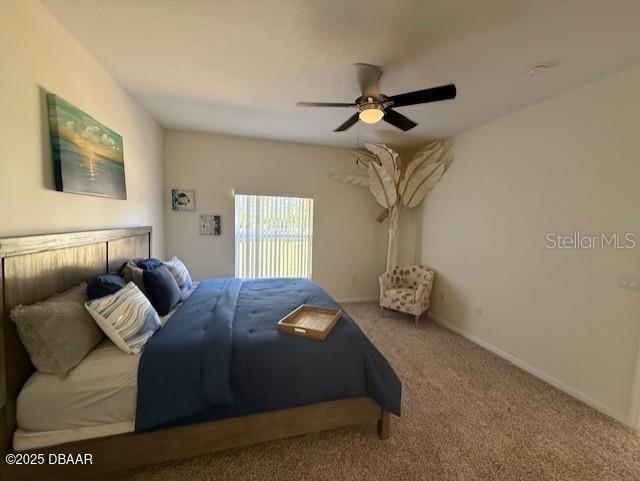 bedroom featuring carpet flooring and ceiling fan