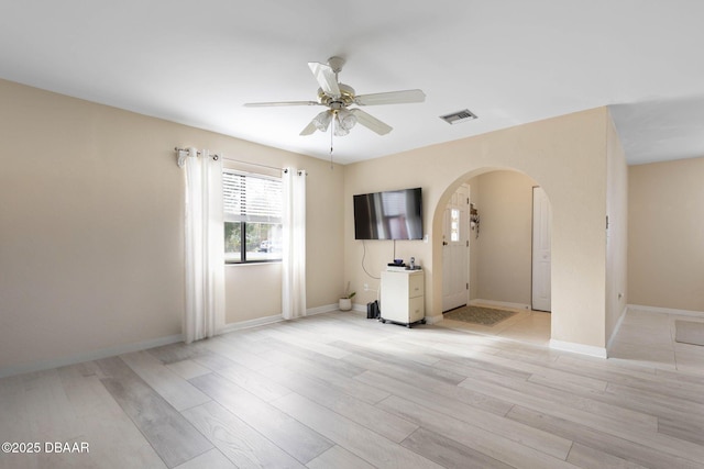 unfurnished room featuring ceiling fan and light wood-type flooring